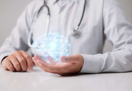 man holding a hologram of a brain