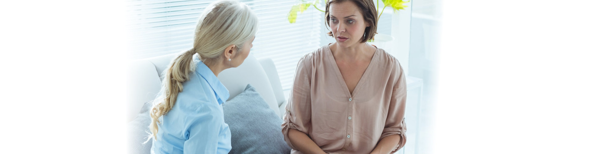 Upset woman talking to therapist