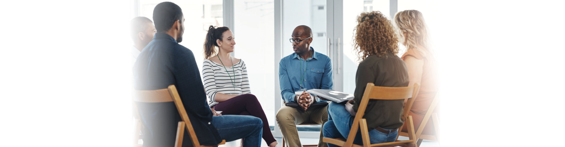 A group therapy session with diverse people sharing their sad problems and stories